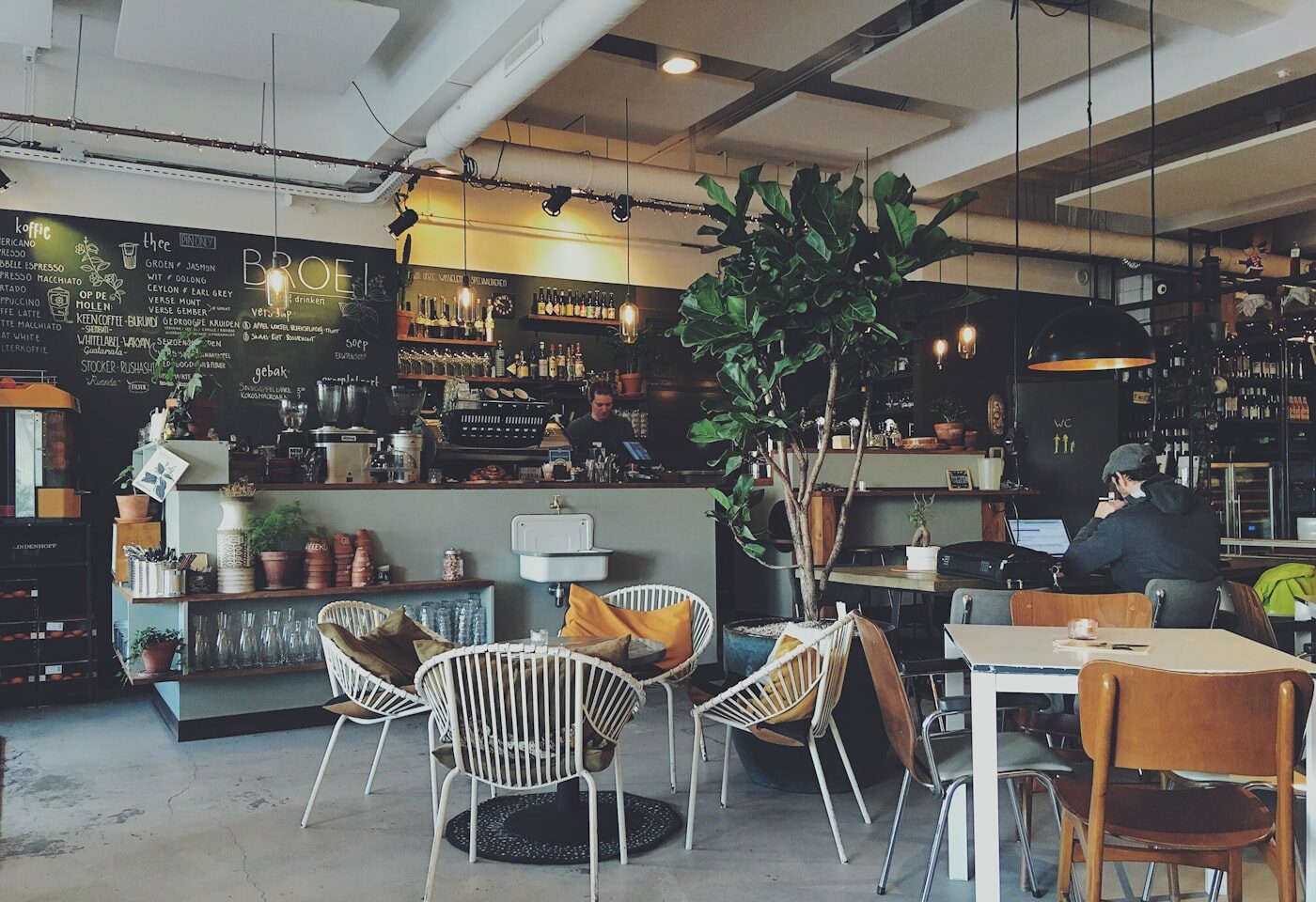 Coffee shop counter where a Review Link Hub QR code can collect reviews and private feedback.